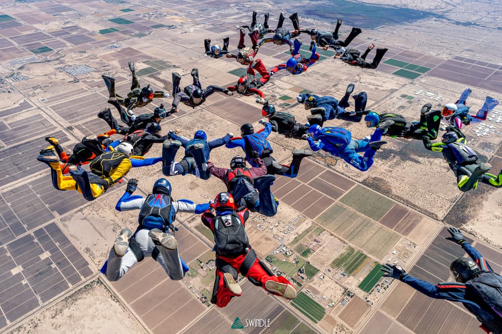 Large skydiving formation over Arizona farmland